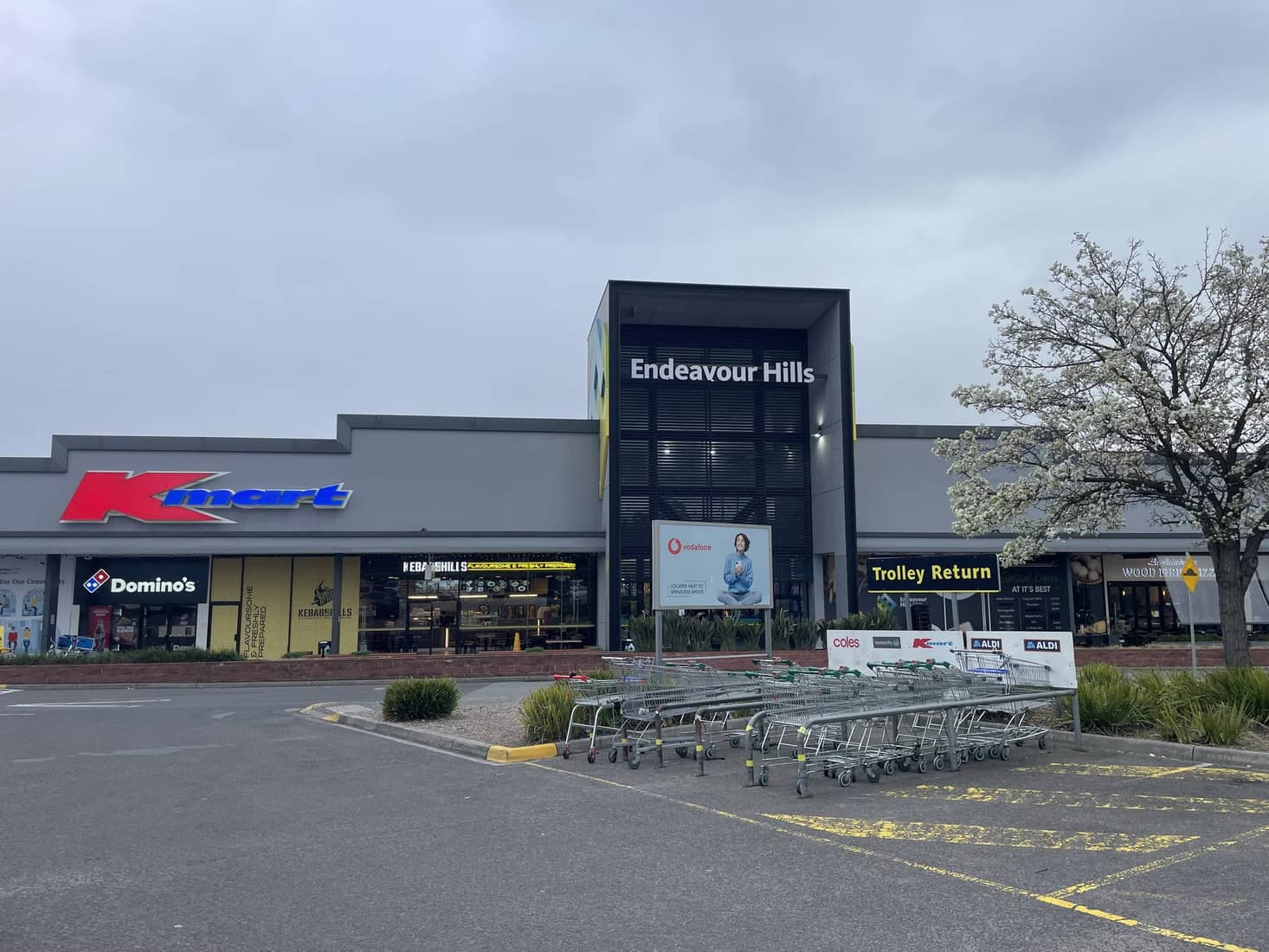 The covered walkway and shopfronts at the entrance to Endeavour Hills Shopping Centre
