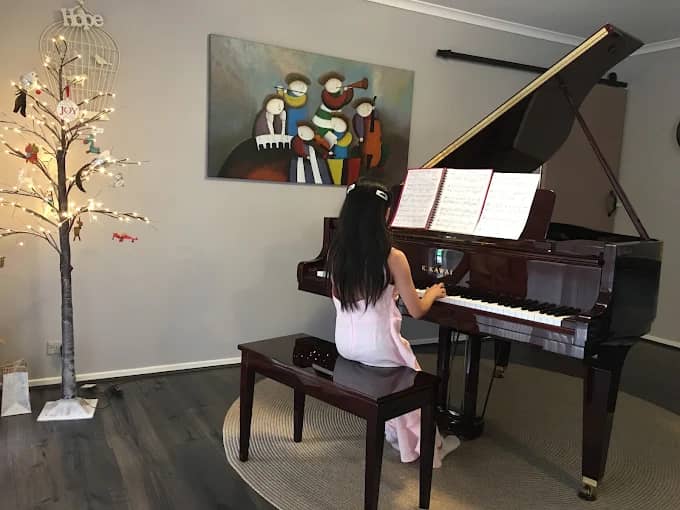 Student playing piano at Daphlyn's Piano Studio