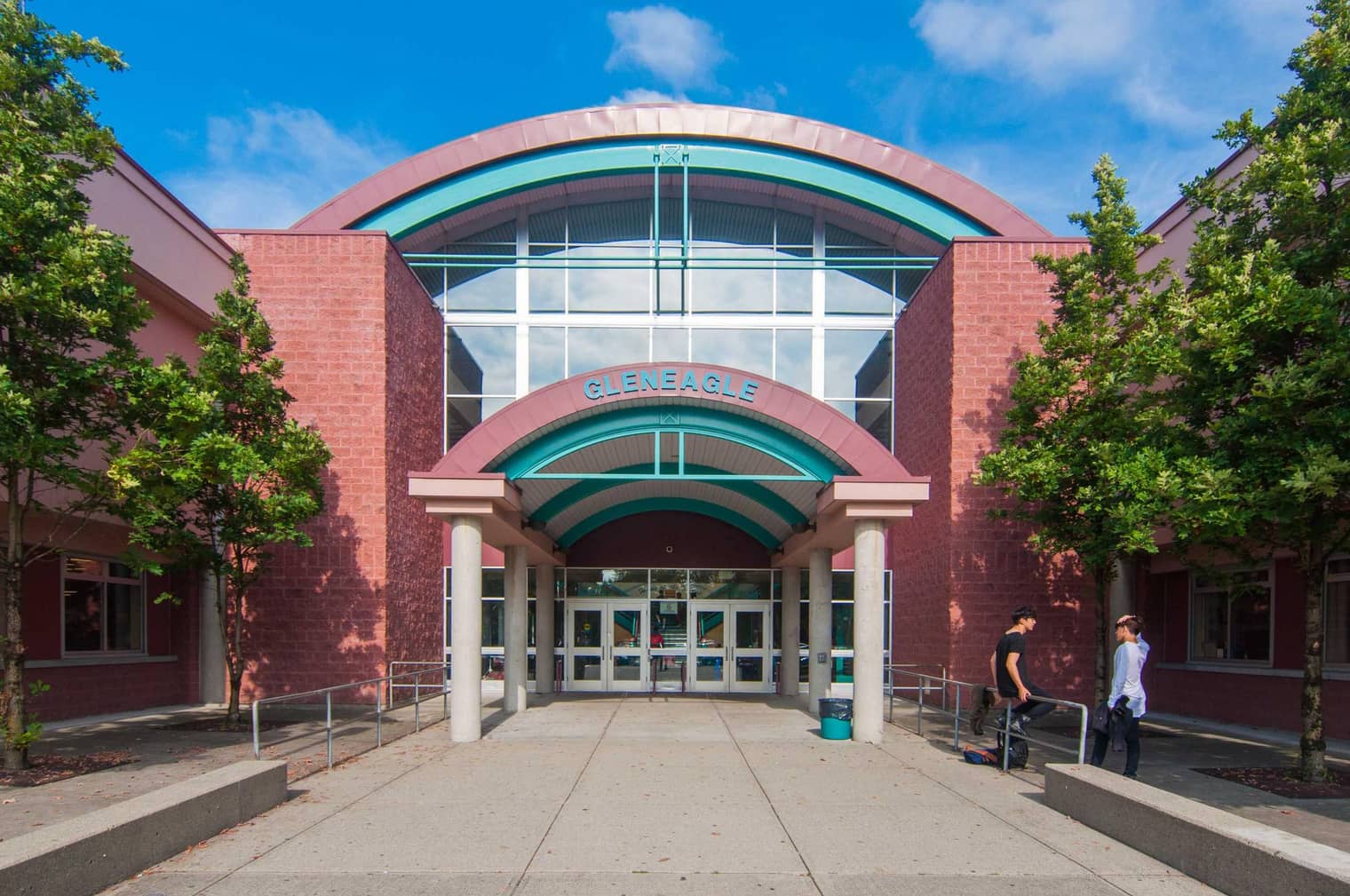The arched glass-and-brick front entrance of Gleneagles Secondary College.